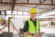 © JU.STOCKER - Engineer man with digital tablet at construction site, Factory foreman worker man in hardhat at the precast factory site