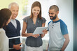 © peopleimages.com - Happy business people, tablet and discussion with research for planning or brainstorming at office. Group of employees or team in collaboration with technology for creative project, design or startup