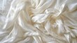 Detailed view of crinkled white silk material