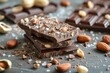 Artisan dark chocolate bars sprinkled with sea salt, almonds, and hazelnuts