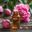 Peony essential oil in bottle on white backgrounds