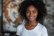 © Spicy World - Young woman smiling in front of textured wall, for marketing campaign and advertising