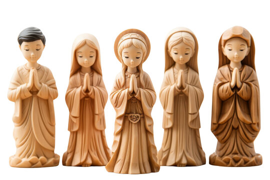 A group of wooden statues of women praying. The statues are arranged in a row, with the first one on the left and the last one on the right. The statues are all similar in size and shape