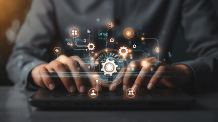 Poster - A person is typing on a laptop with a keyboard that has a gear on it