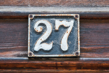 Wall Mural - Old retro weathered cast iron plate with number 27