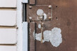 Metal old peeled rusty doors with a key in the keyhole. Photography, retro architecture concept.