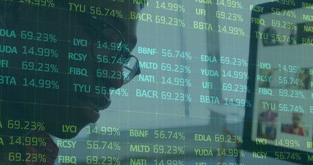 Poster - Image of stock market data over african american businessman in eyeglasses working over computer