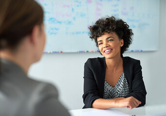 Canvas Print - Woman, office and business or talking in meeting, company and work collaboration with employee for partnership. Together, coworkers and smile for target goal and review conversation, staff and career