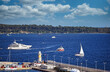 Luxury yachts sailing near port in Cannes city summer season France