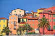 Old Colorful buildings and palm trees in Menton summer season