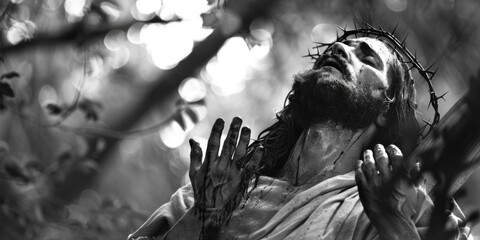 Wall Mural - A black and white photo of a man wearing a crown of thorns. Suitable for religious or historical themes