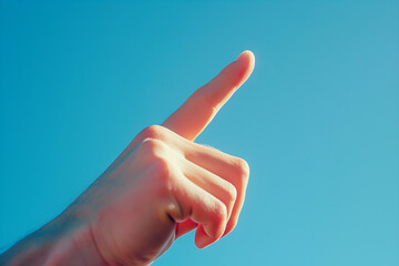 hand with finger pointing on blue background