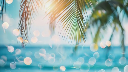 blurred blue sky and sea with bokeh light and leaves of coconut palm tree landscape of tropical summ