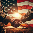 Close-up of two soldiers shaking hands on the background of the American flag