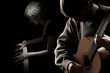 Acoustic guitar piano player. Classical guitarist and pianist musicians playing chamber music ensemble
