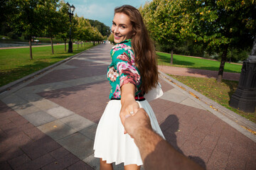 Poster - Follow me, Beautiful young woman holds the hand of a man