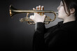 Trumpet player playing jazz musician. Woman playing trumpet brass instrument