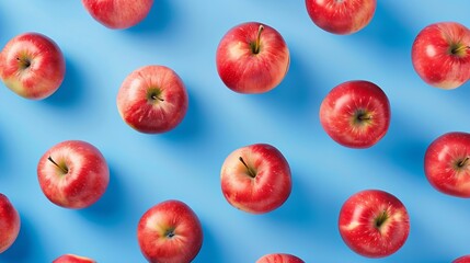 Poster - Colorful fruit pattern of fresh red apples on blue background From top view : Generative AI