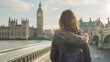 © Generative AI - Tourism in London Back view of traveler girl enjoying sight of Westminster palace and bridge on Thames with famous Big Ben tower in London UK : Generative AI