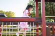 Cute asian girl playing in the playground