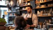 © SKW - A man in a chef's uniform stands behind a counter in a restaurant. A woman is sitting at a table in front of him
