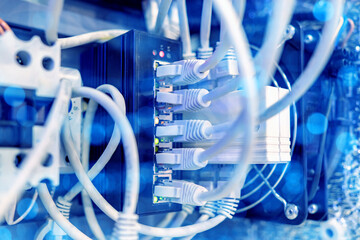 Poster - network equipment wires are connected to switches. electrical equipment close-up. internet technolog