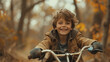 © kurostd - a boy with a smile rides his bicycle