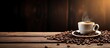 © StockKing - An image of a cup of coffee and coffee beans on an aged wooden surface with empty space for text or other elements. Copyspace image