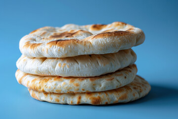 Poster - Pita bread on a subtle blue gradient background, soft focus, emphasizing simplicity and freshness 