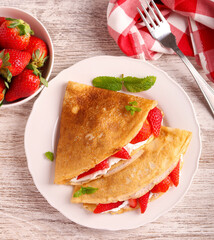 Wall Mural - Crepes with sour cream and strawberry filling