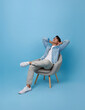 Home lifestyle Calm young asian man relaxing sleeping on sofa isolated on blue background.
