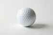 pristine white golf ball isolated on pure white background minimalist sports equipment photography