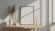 Minimalist office setup with a blank photo frame mockup