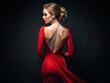 Beautiful Young Woman in Dress with open Back. Pretty blond Girl