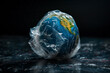 Planet earth wrapped in plastic. The concept plastic pollution of the Earth.