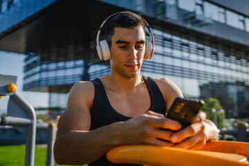 Poster - One man caucasian young male stand at outdoor open training park gym