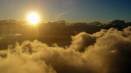 Wall Mural - aerial view of clouds and morning sun