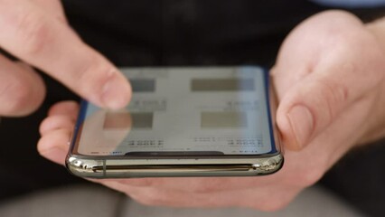 Poster - Young man running content of social media network, looking for information on screen of his smartphone, closeup