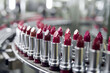 © barmaleeva - Lipsticks with filling machine in a cosmetics factory