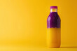 refreshing beverage in purple and yellow bottle with condensation, copy space for text 