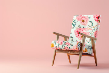 Wall Mural - chair with floral upholstery against soft pink background, copy space for text 