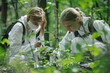 Young scientists conducting field research in a forest, documenting plant and animal species and observing ecosystems in their natural habitat.  Generative Ai.