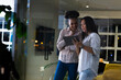 © Wavebreak Media - At office, diverse female business colleagues studying tablet, working late