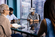 © Wavebreak Media - A diverse team meeting at office, one wearing virtual reality headset