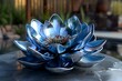 a metal sculpture of a blue lotus flower on a table