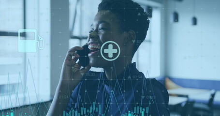 Poster - Image of icons, graphs and changing numbers, smiling african american woman talking on cellphone
