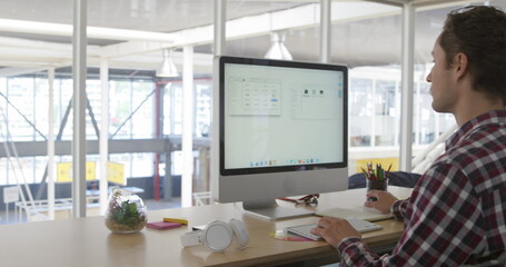 Aufkleber - Image of caucasian male colleague, wearing plaid shirt, studying large screen