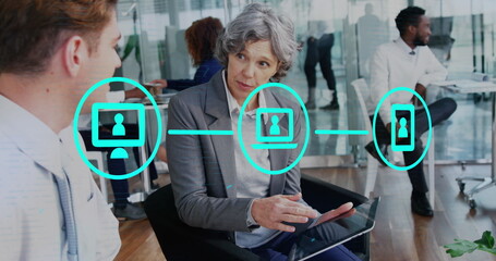 Poster - Image of network of icons over diverse businessman and businesswoman discussing at office