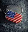 US military soldier's dog tags, rough and worn with blank space for text, and in the shape of the American flag. Memorial Day for Veterans Day concept.