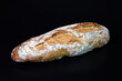 Baguette isolated on black background. Traditional French baked